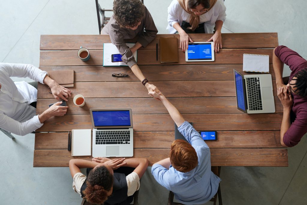 accounting team having a meeting on a wooden table