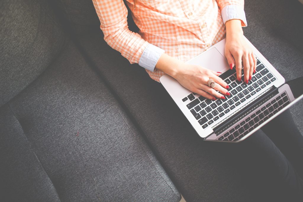 top view photo of an accountant working with her laptop