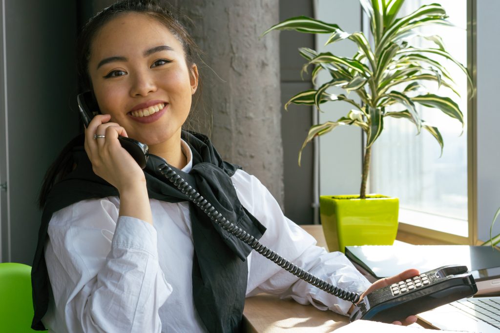 accountant happily taking client calls