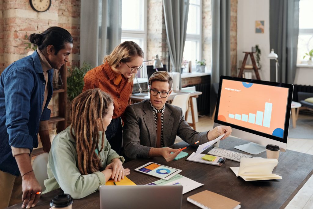 accountants discussing the growth that is on the monitor