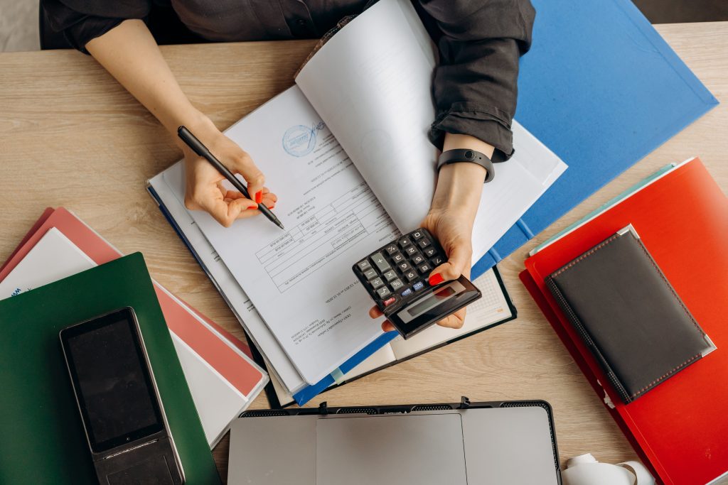 accountant doing calculations using a calculator