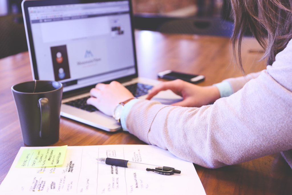 male accountant working on a laptop