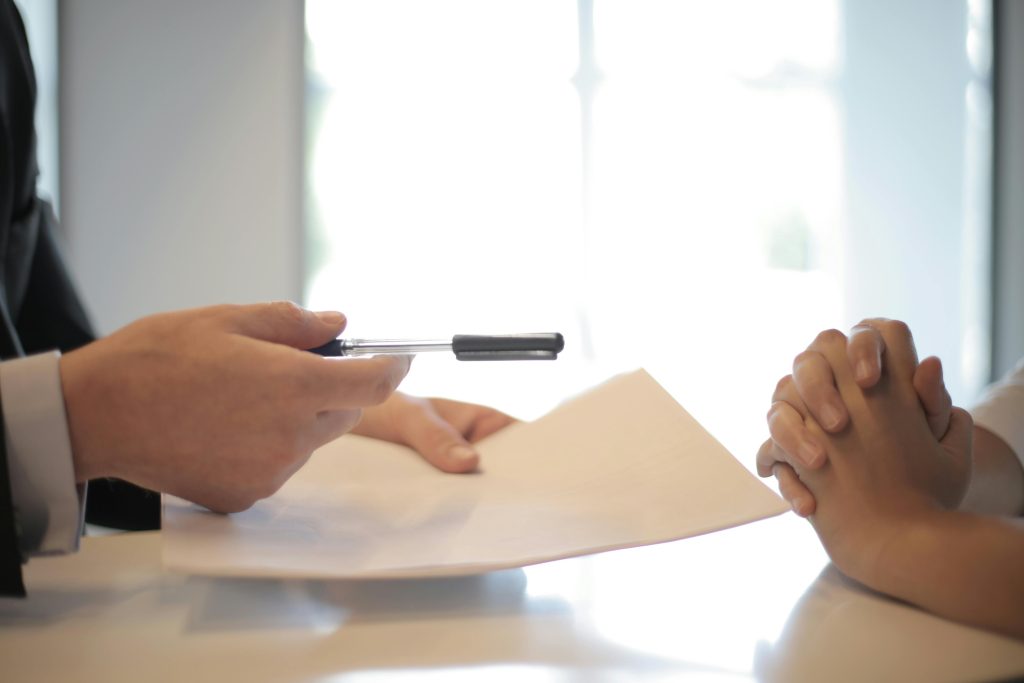 accountant explaining to his client the details that is on the paper