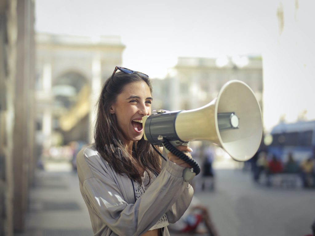 women shouting while outside