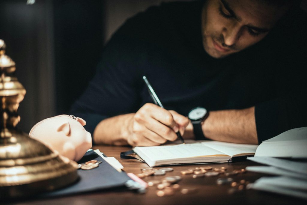 accountant working hard and jotting down notes