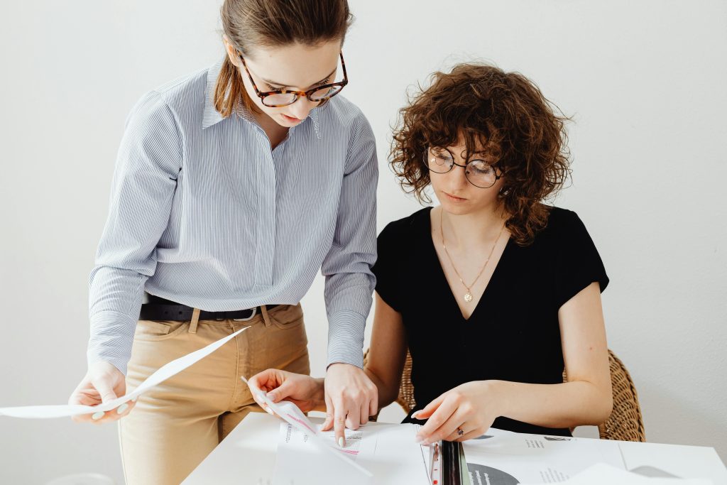 two female accountants working and checking the data